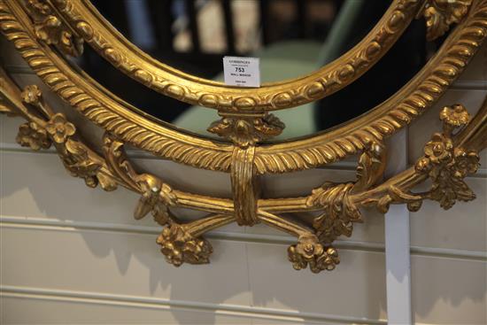 A Victorian oval gilt wall mirror, 4ft 11in. x 2ft 9.5in.